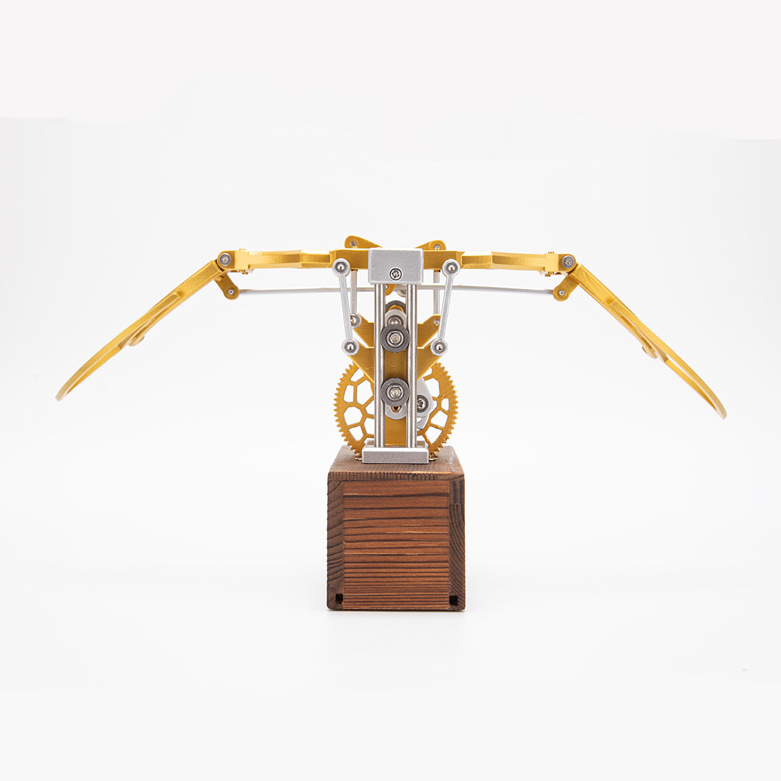 Finished DIY mechanical metal model with flapping wings displayed on desk
