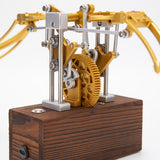 Finished DIY mechanical metal model with flapping wings displayed on desk