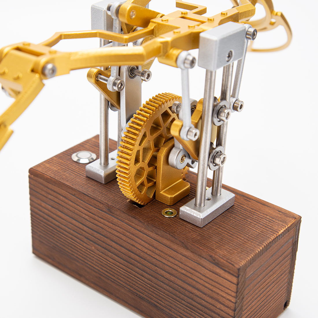 Finished DIY mechanical metal model with flapping wings displayed on desk